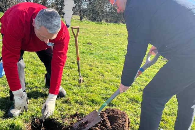 Coun Andy Burgin, left, and Mansfield mayor Andy Abrahams plant a tree.