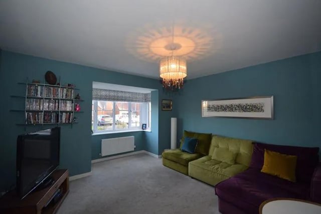 A spacious lounge is one of two reception rooms in the property.