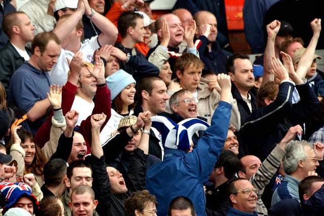 Spireites fans celebrate avoiding relegation from Division Two after a 1-1 draw against Blackpool in 2003.