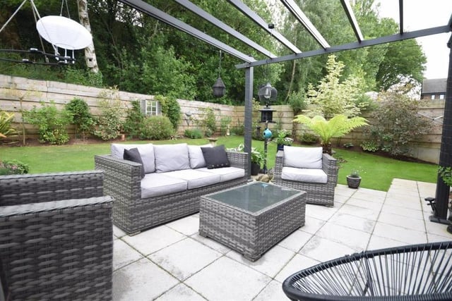 The back garden is topped off by this charming, paved patio seating area, with pergola. It is ideal for summer barbecues and al fresco dining because bi-folding doors lead directly to the kitchen.