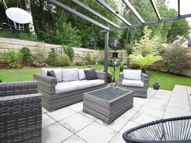The back garden is topped off by this charming, paved patio seating area, with pergola. It is ideal for summer barbecues and al fresco dining because bi-folding doors lead directly to the kitchen.