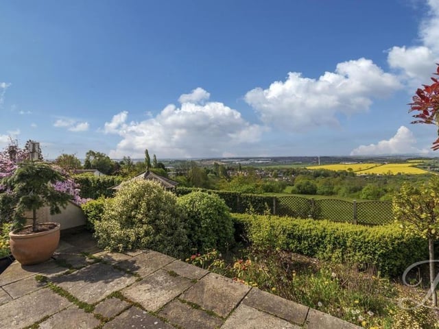 Picturesque countryside and the rolling Derbyshire hills make up the amazing view from the back of the Huthwaite bungalow.