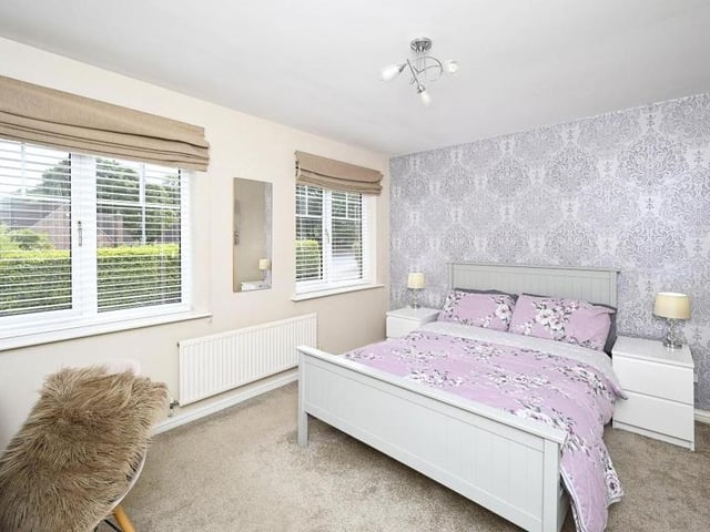 Bedroom number two, which overlooks the front of the property, is bright and light.