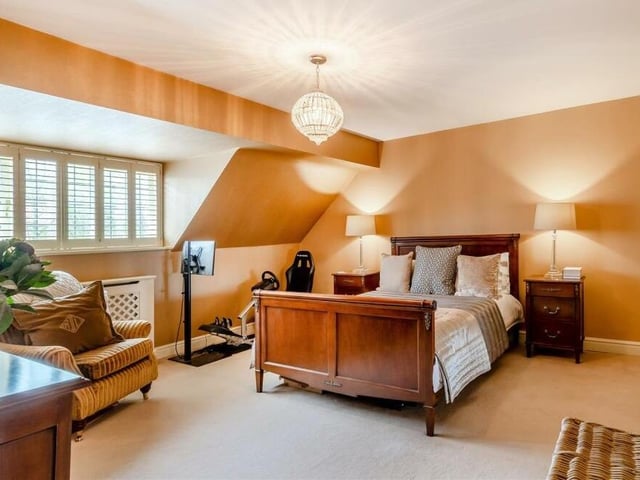 This bedroom offers size and style in equal measure.There is a built-in storage cupboard and plenty of space for furniture.