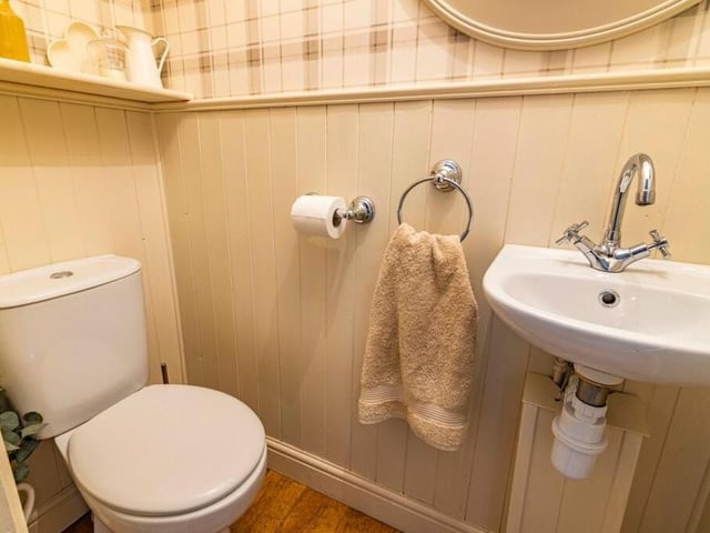 Here is the toilet on the ground floor, complete with a WC and wall-mounted sink.