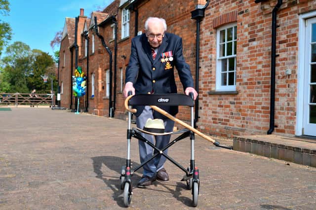 British World War II veteran Captain Tom Moore completed 100 laps of his garden in a fundraising challenge for healthcare staff that has "captured the heart of the nation", raising more than £13 million (Photo by JUSTIN TALLIS/AFP via Getty Images)