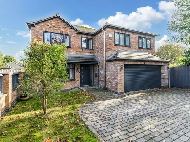 The front driveway leads to an integral double garage that is equipped with an electrically operated door, power and lighting.