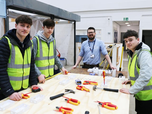 Quarrydale's Jacob Czarnecki, Alfie Coupe & Liam Naylor and teacher Robert Hardwick on electrical sockets