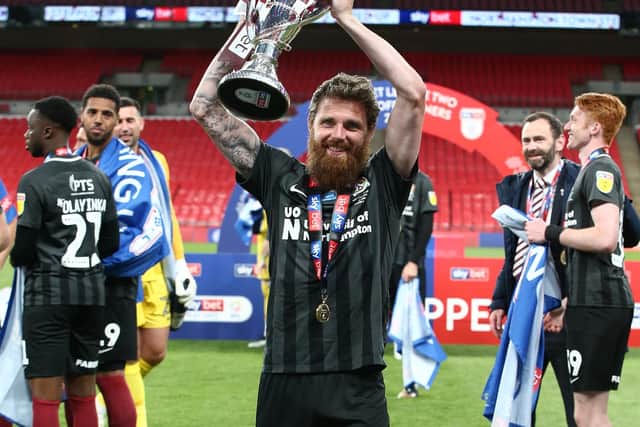 Paul Anderson of Northampton Town celebrates victory with the League Two Play Off Trophy. (Photo by Pete Norton/Getty Images)