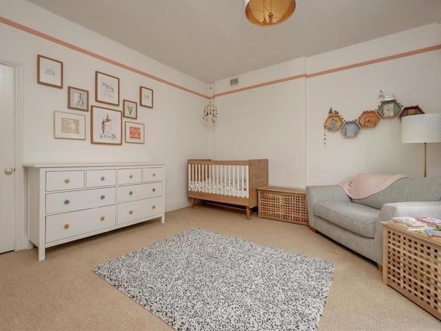 This third double bedroom at Norfolk House is so spacious that it features its own walk-in wardrobe. Again, there are two floor-to-ceiling, double-glazed sash windows that face the front of the property.