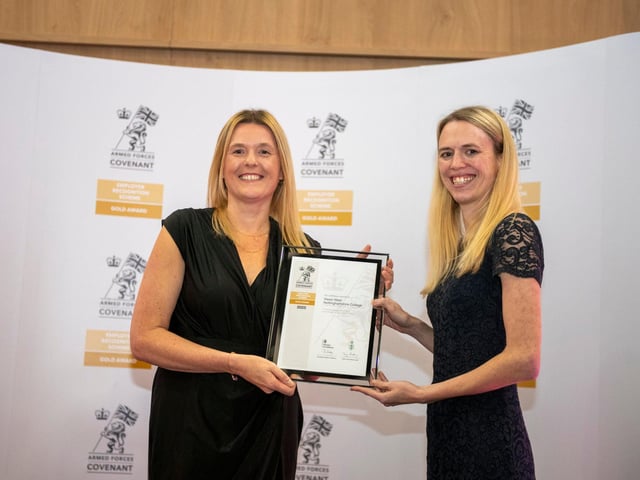 The college’s director of human resources and organisational development, Sian Geeson (left), collected the award from Minister for Veterans and People, Louise Sandher-Jones MP.