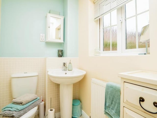 The main bedroom has its own compact en suite bathroom. It comprises a shower cubicle, wash hand basin with mixer tap and WC.