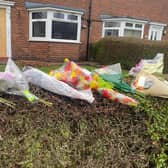 Floral tributes have been left out of the house in Sutton where a man in his 80s sadly died following a fire