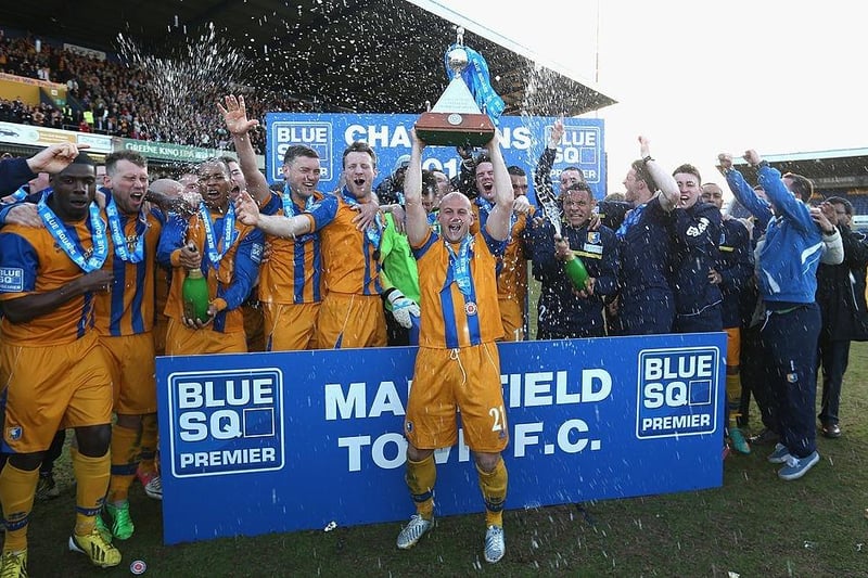 Adam Murray lifts the trophy as Mansfield celebrate winning the Blue Square Bet Premier League on April 20, 2013.