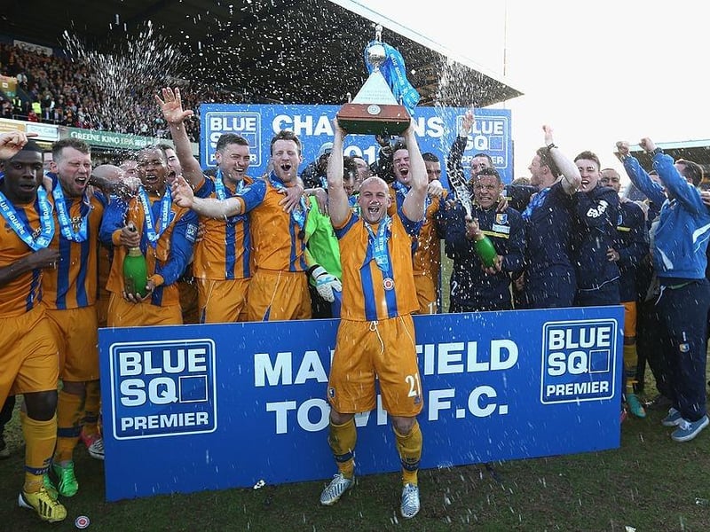 Adam Murray lifts the trophy as Mansfield celebrate winning the Blue Square Bet Premier League on April 20, 2013.
