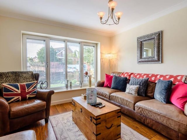 A second view of the lounge, which underlines that it is the perfect place to relax. The floor is laminated and there is coving to the ceiling.