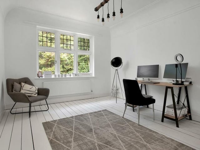 The versatility of the first-floor bedrooms is again underlined by this third one, which has been converted into a smart home office.