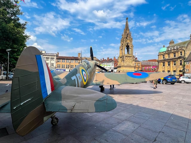A view of the market square, complete with Spitfire.