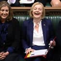 Liz Trussm centre, with Leader of the House of Commons Penny Mordaunt, left, Health Secretary and deputy Prime Minister Therese Coffey in Parliament.