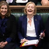 Liz Trussm centre, with Leader of the House of Commons Penny Mordaunt, left, Health Secretary and deputy Prime Minister Therese Coffey in Parliament.