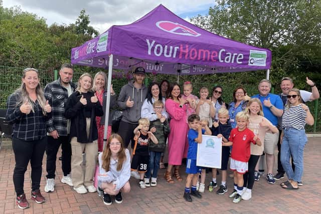 Thumbs up, after the latest award, from Your Home Care's office and community team at a barbecue to celebrate the company's third birthday. (PHOTO: Submitted)