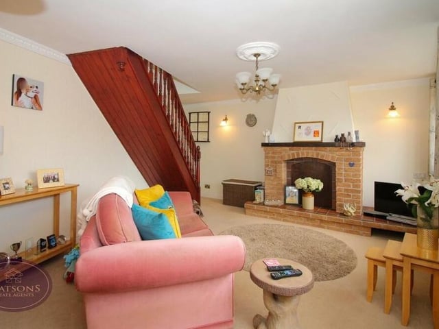 The lounge at the annexe is a cosy room, with feature fireplace, window to the front and stairs to the first floor.