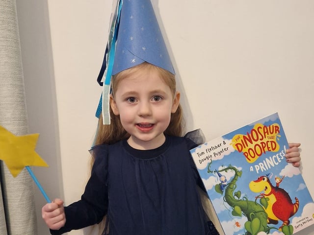 Lyla-Mae, age 4, dressed as a princess from the The dinosaur that pooped series.