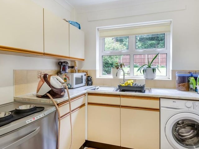 Off the kitchen is a rear lobby that leads to this handy utility room, which includes plumbing for a washing machine and space for other appliances. There are also wall cupboards, base units and drawers with work surfaces, and an inset stainless steel sink.