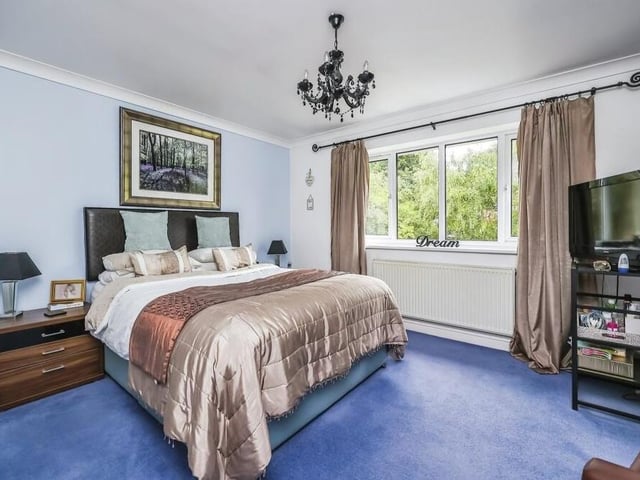 As the sign says on the window sill, the master bedroom is a dream. It overlooks the back garden, has a carpeted floor and access to an en suite shower room.
