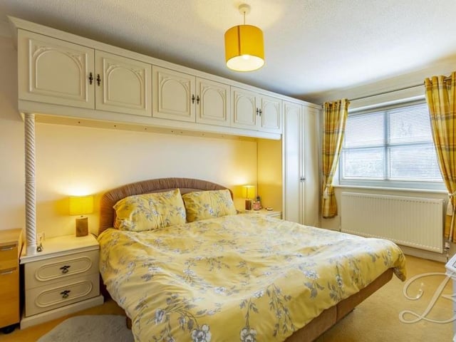 All four bedrooms have been kept to a high standard, including this one, which has a carpeted floor, fitted wardrobe unit and windows to the side and rear of the property.