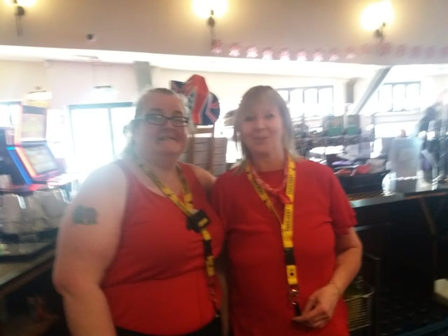 Standing ready to serve as pubgoers prepare to celebrate.