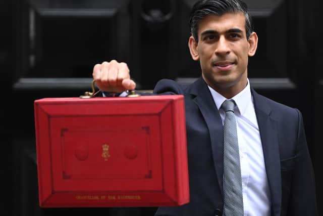Chancellor Rishi Sunak with his Budget Box ahead of presenting his Autumn Budget and Spending Review to Parliament.