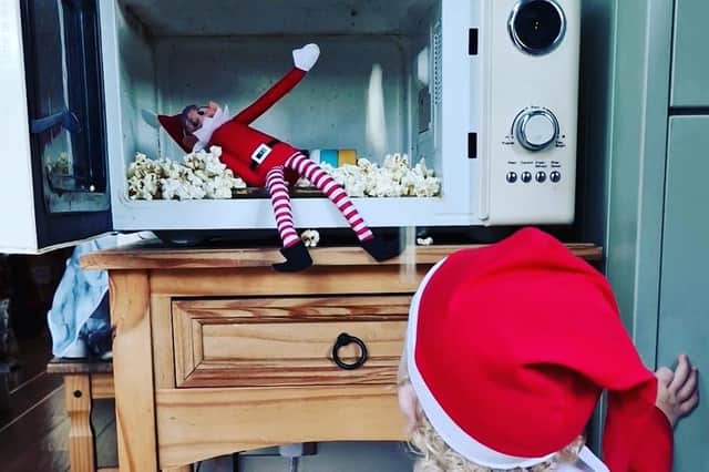 Bubbles the Elf decides to make popcorn with the help of the traditional Elf on the Shelf