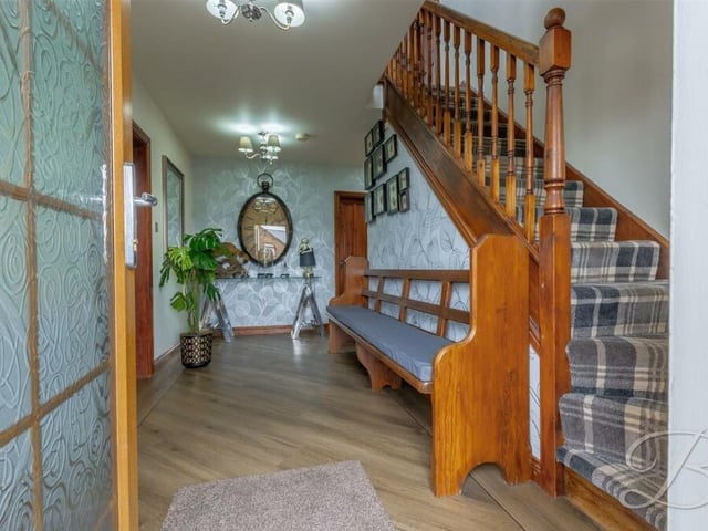 This is a better image of the hallway, revealing a charming space and staircase.