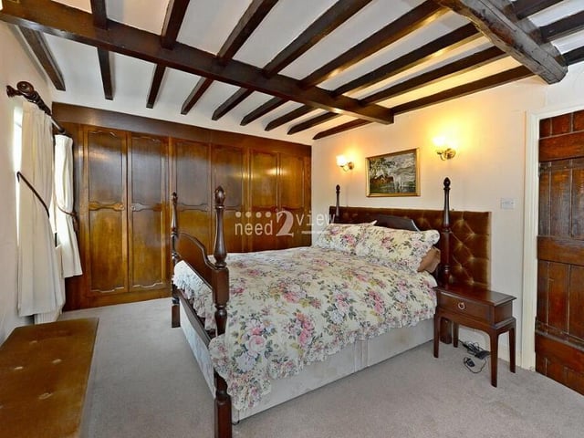 Fitted wardrobes and ceiling beams are also features of bedroom number two, which makes for a splendid sight.