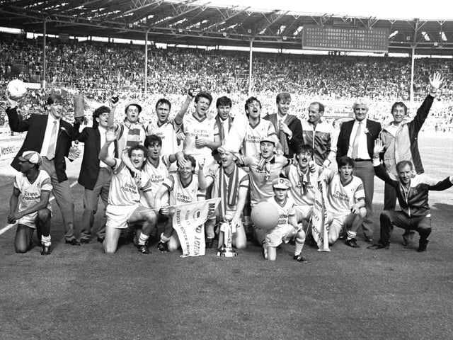 The winning team with the trophy