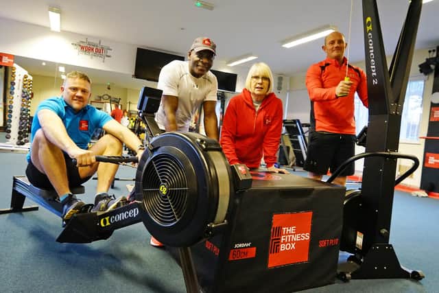 Gym owner Lloyd Scott and fitness instructor Carol Atherton (both centre) take part in an Ironman Challenge at The Fitness Box that helped to generate money to buy three defibrillators for Mansfield Woodhouse.