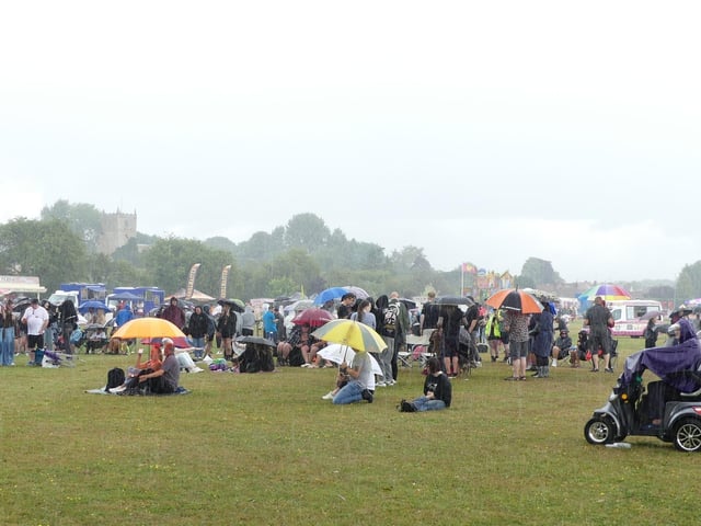 Music fans in the rain.