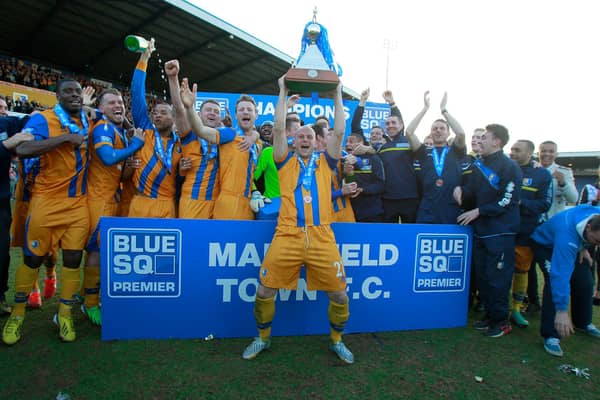 Adam Murray lifts the Conference Trophy. Pic by Richard Parkes