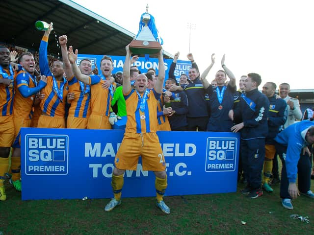 Adam Murray lifts the Conference Trophy. Pic by Richard Parkes