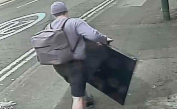 Kirk Bradley was pictured on CCTV hauling a smart TV down a street in Sherwood at 10.30 in the morning.