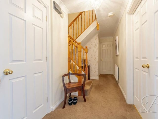 As we prepare to check out the first floor at the £725,000 Mansfield home, let's pass through the entrance hallway, with its fitted carpets, storage cupboard and staircase.