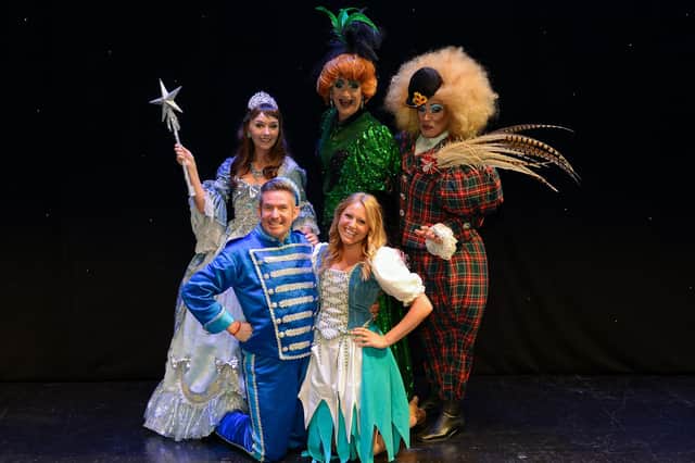 Cinderella from 2019, pictured are Melanie Walters as the Fairy Godmother, Adam Moss as Buttons, Olivia Birchenough as Cinderella and Jamie Morris and Tarot Joseph as the Ugly Sisters