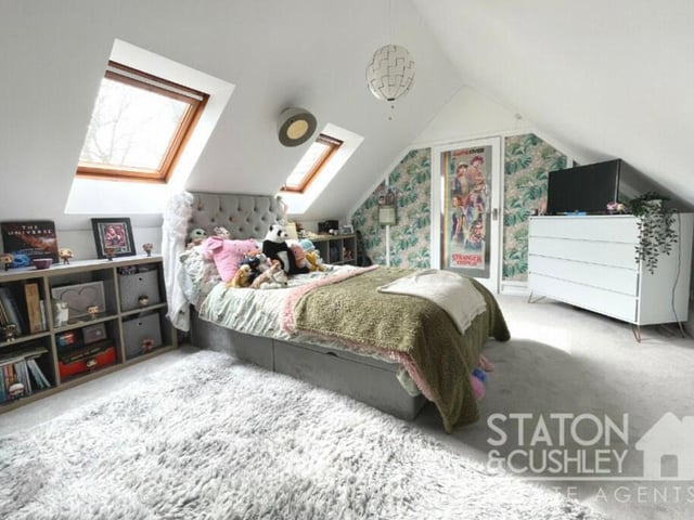 A delightful bedroom that oozes comfort and style. It has access to an en suite shower room, while double-glazed Velux windows face the side of the property.