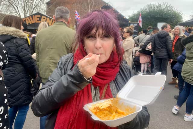 Festival-goer Gwyneth Lewis tucking into a chicken curry and chips.