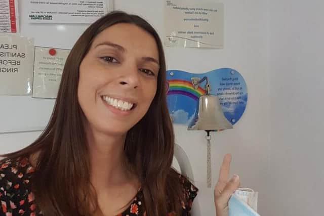 Claire ringing her final treatment bell - she has now been given the all-clear.