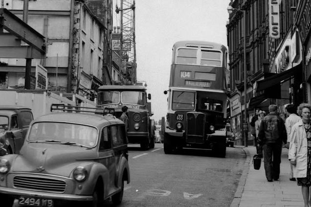 Leeming Street in 1963 is bustling with traffic and people.