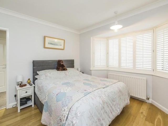 The first bedroom features a big, double-glazed bay window overlooking the front of the property. It has oak flooring and also access to an en suite wet room.