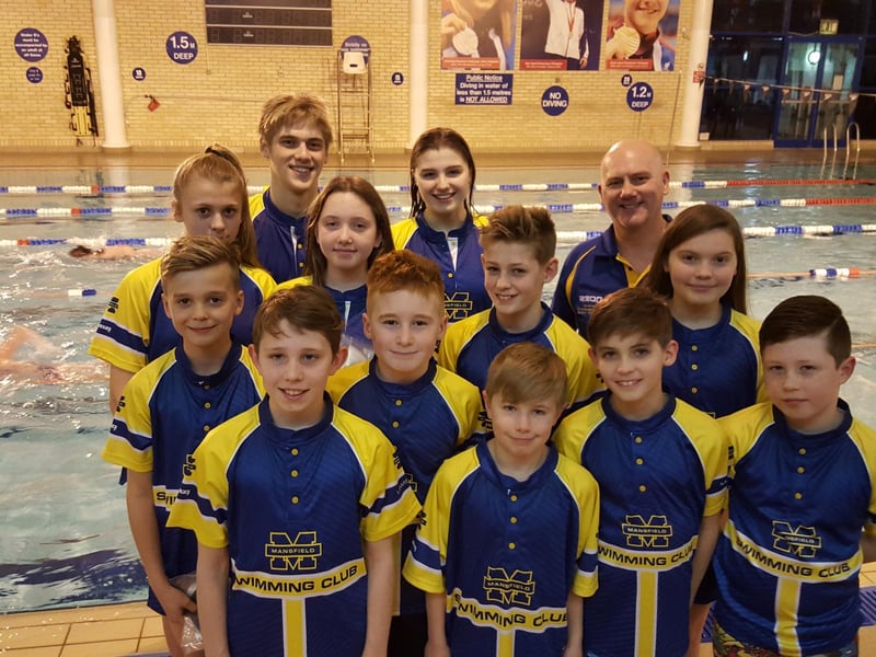 Youngsters from Mansfield Swimming Club pose for a picture in team colours.