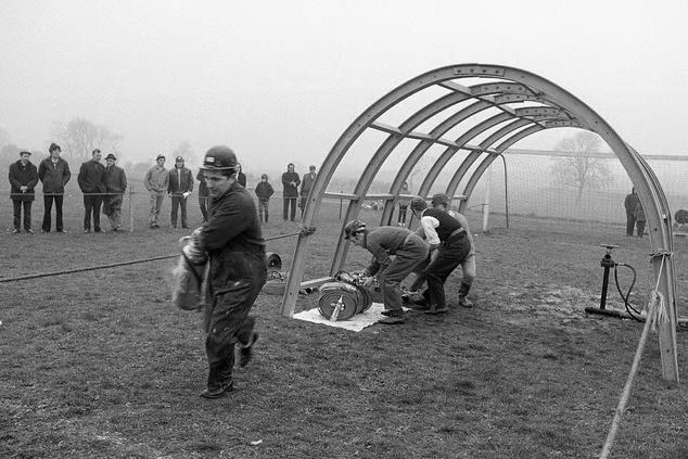 Farm work carried out in Blidworth in 1970 as people look on.